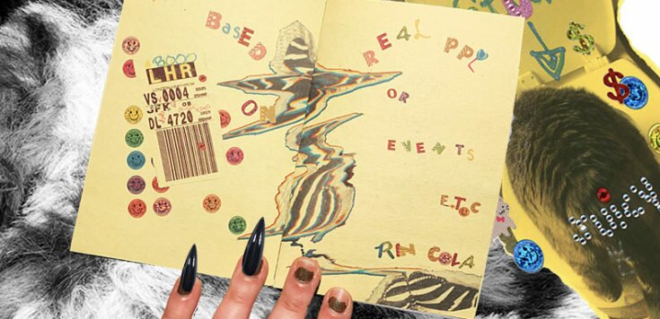 A hand with two long false nails holding open a yellow artist book that is a print collage of small smiley faces, luggage flight tag, birds and text reading ' Not Based on Real PPL or Events ETC'
